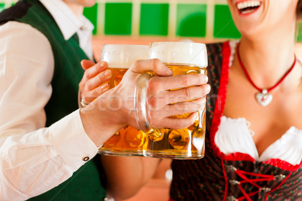 Stock photo: Man and woman with beer glass in brewery