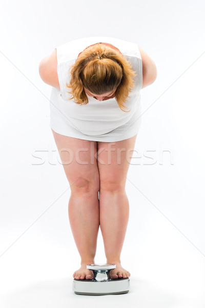 Elhízott fiatal nő áll mérleg diéta súly Stock fotó © Kzenon
