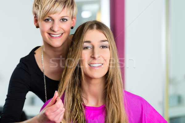 Woman at the hairdresser getting advise Stock photo © Kzenon