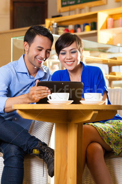 Asian woman and man in an coffee shop Stock photo © Kzenon
