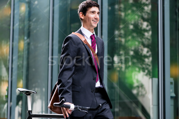 Smiling Man Walking Through Town With His Bike Stock Photo C Kzenon Stockfresh