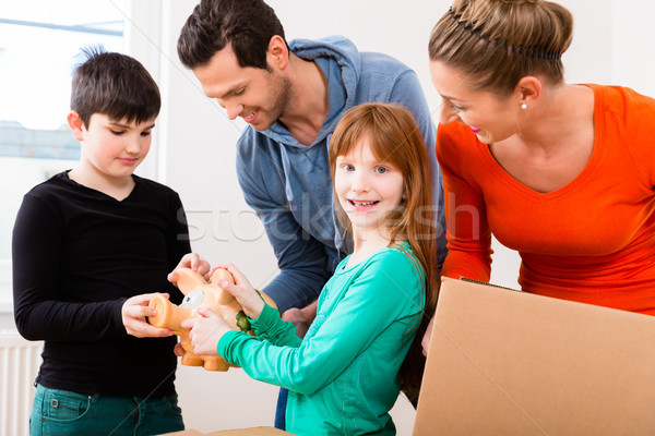 Family moving into new home Stock photo © Kzenon