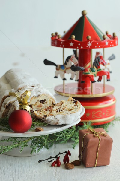 Christmas cake - stollen, bauble and carousel music box Stock photo © laciatek