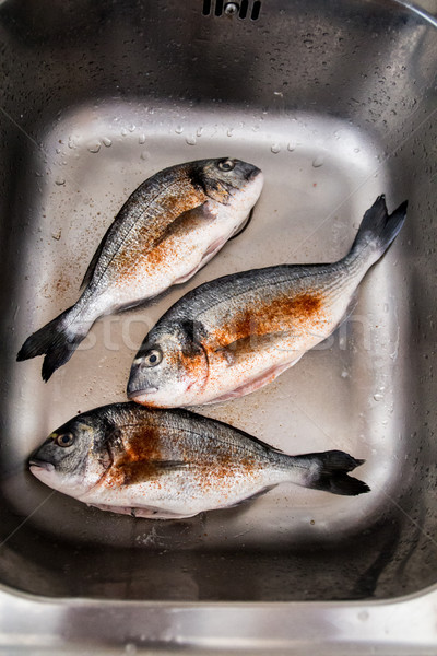 Framed and seasoned fresh dorada fish Stock photo © laciatek