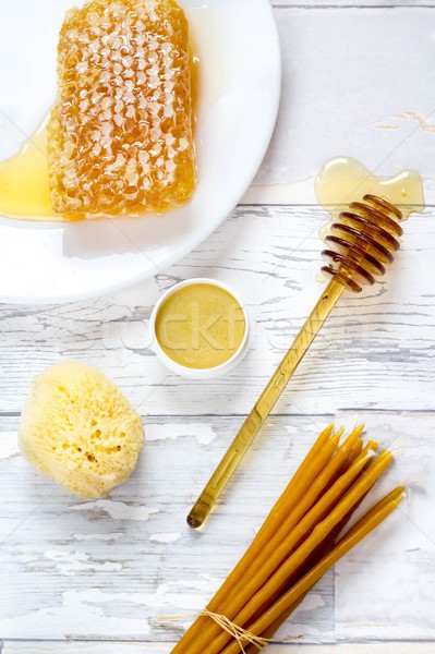 natural sponge, honeycomb, honey balm and natural wax candles background Stock photo © laciatek