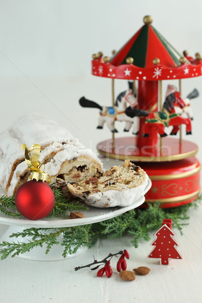 Christmas cake - stollen, bauble and carousel music box Stock photo © laciatek