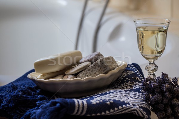 lavender flowers, towel, bathroom accessories and a glass of white wine - home spa Stock photo © laciatek