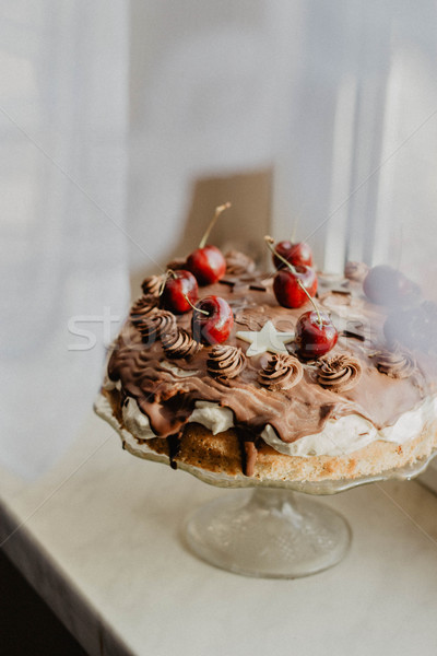 a delicious cake with cherries and chocolate stars Stock photo © laciatek