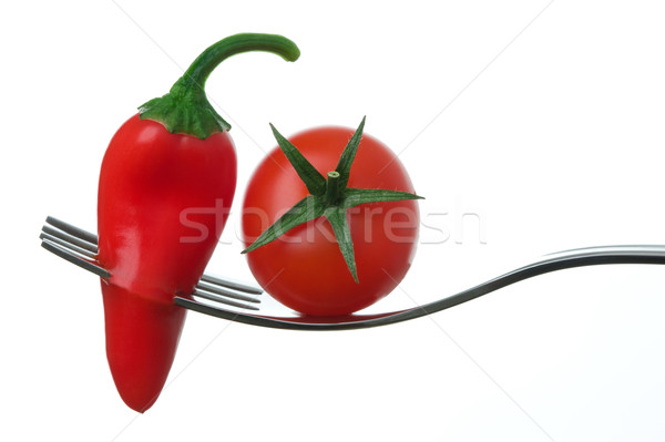 chili pepper and tomato on a fork Stock photo © leeavison