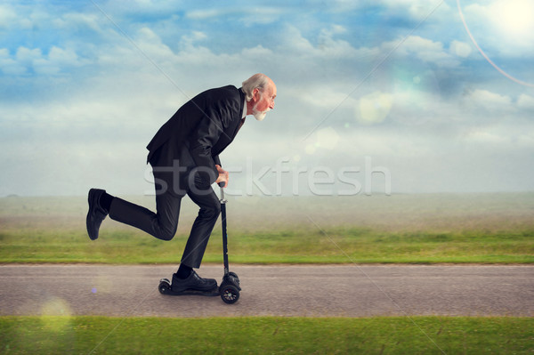 senior man riding a scooter Stock photo © leeavison