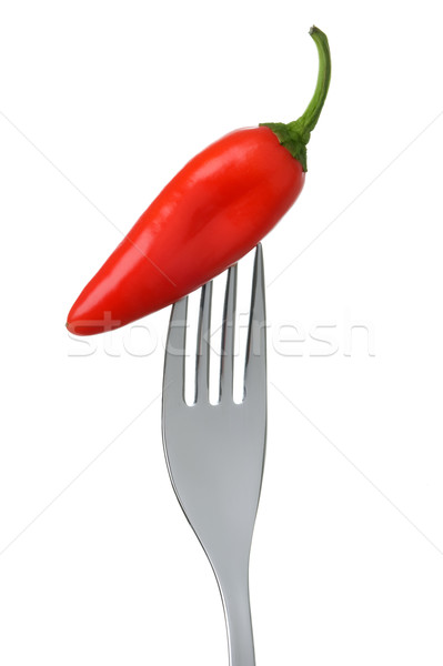 chili pepper on a fork on white Stock photo © leeavison