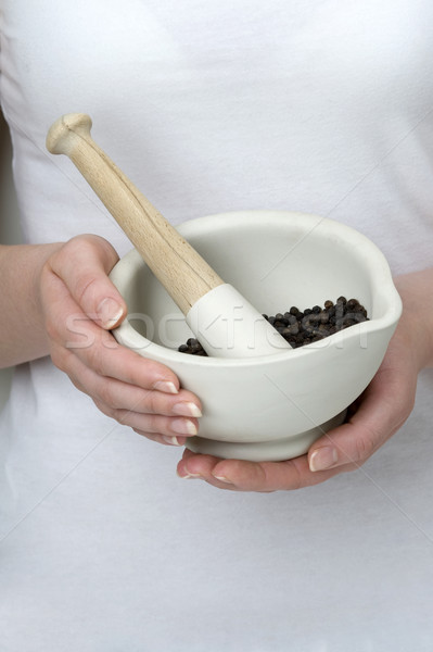 woman pestle and mortar black pepper Stock photo © leeavison