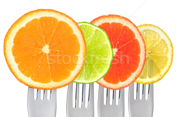 Stock photo: cirtus fruit on forks isolated against white background
