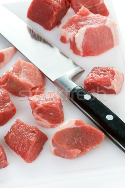 dicing raw lamb with a kitchen knife Stock photo © leeavison