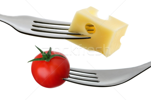 tomato and cheese on a fork against white background Stock photo © leeavison