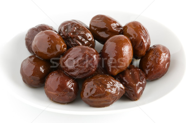 canned prunes on a dish isolated Stock photo © leeavison