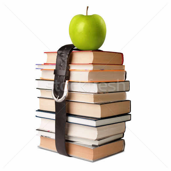 books pile with belt and apple Stock photo © leedsn