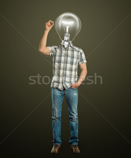 Stock photo: asian male with lamp writting something
