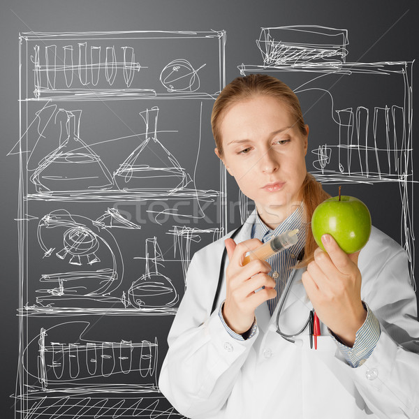 scientist woman with apple Stock photo © leedsn