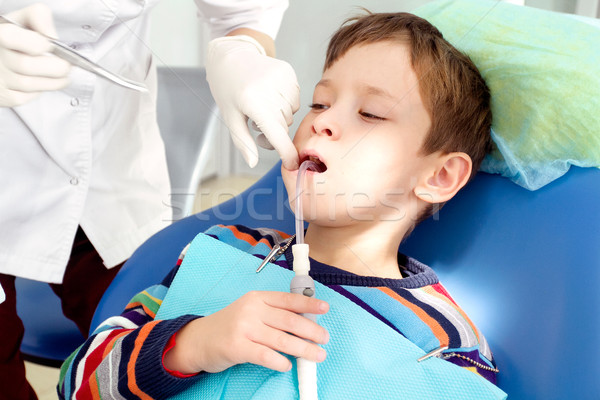 Boy and dentist during a dental procedure Stock photo © leedsn