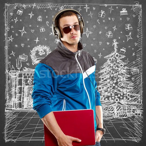 Hombre mirando Navidad regalos música Foto stock © leedsn