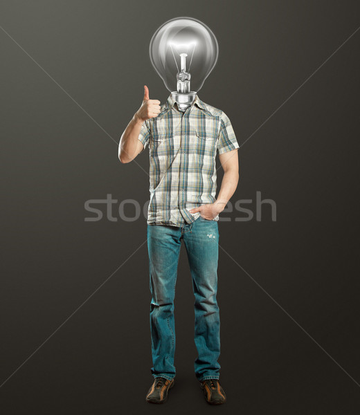 full length man with lamp shows well done Stock photo © leedsn