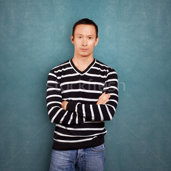 Asian Man In Striped Pullover Stock photo © leedsn