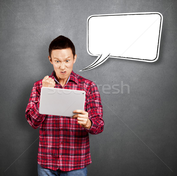 Asian Man With Touch Pad Stock photo © leedsn