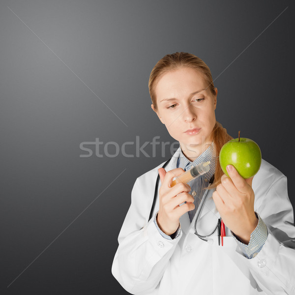 scientist woman with apple Stock photo © leedsn