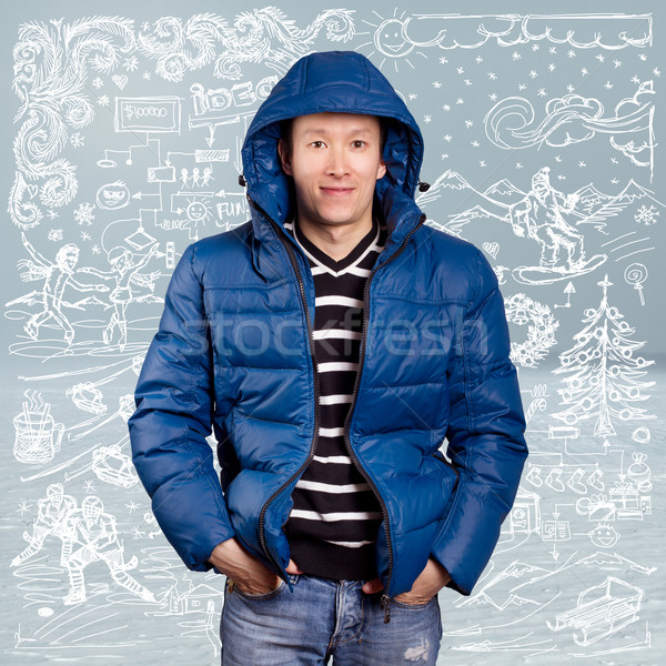 Asian człowiek w dół płaszcz niebieski zimą Zdjęcia stock © leedsn