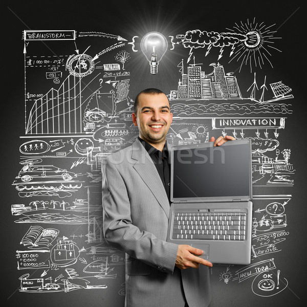 Idea Concept businessman with open laptop in his hands Stock photo © leedsn
