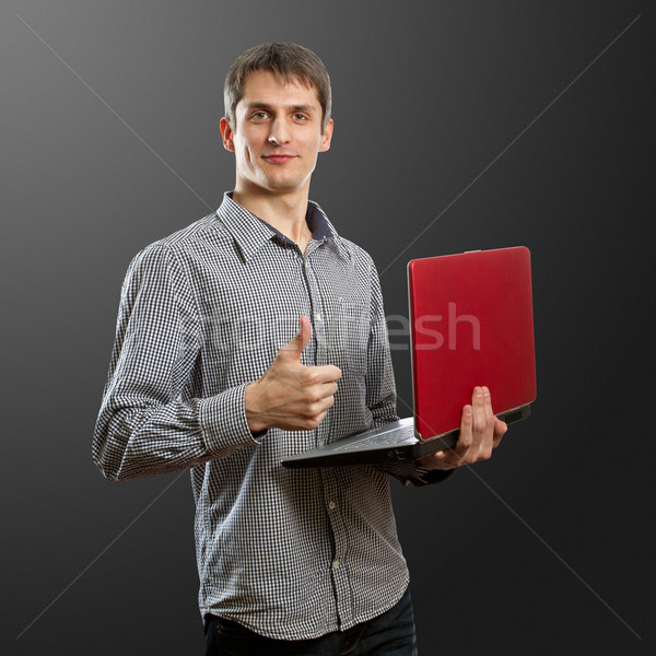 male with laptop in his hands well done Stock photo © leedsn