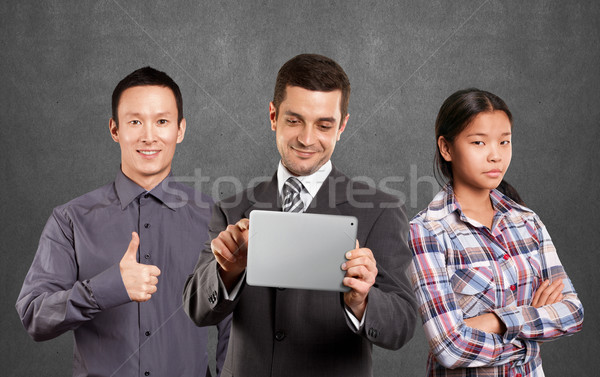 Asian team and Businessman With Touch Pad Stock photo © leedsn