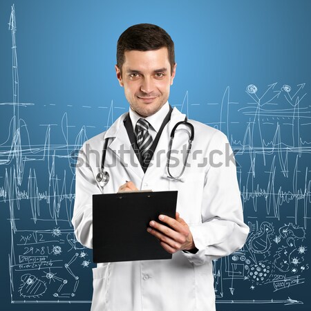 Médico hombre escribir bordo manos sonrisa Foto stock © leedsn