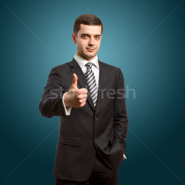 caucasian male shows well done Stock photo © leedsn