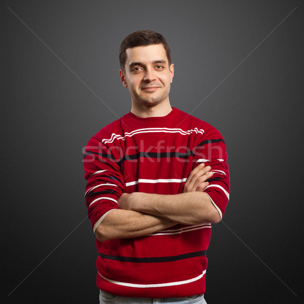 Jonge mannelijke glimlacht Rood trui camera Stockfoto © leedsn