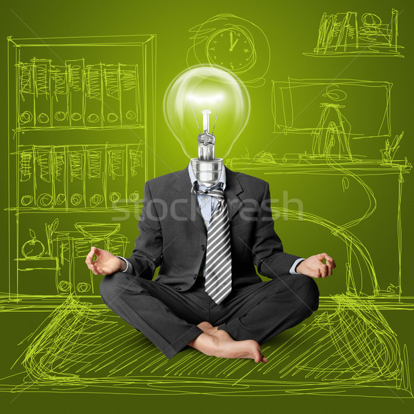 Stock photo: lamp-head businessman in lotus pose