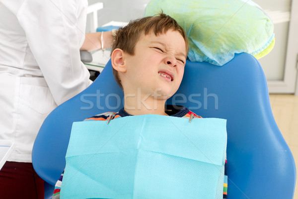 Boy and dentist during a dental procedure Stock photo © leedsn