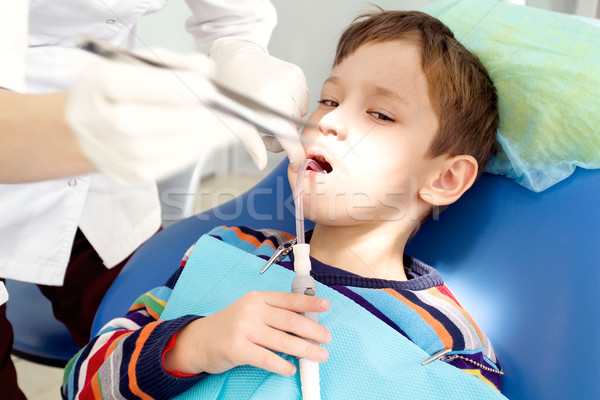 Boy and dentist during a dental procedure Stock photo © leedsn