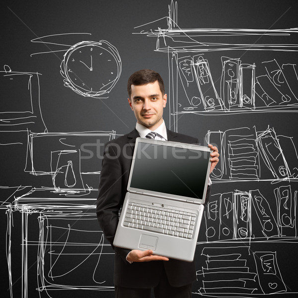 Stock photo: businessman with open laptop in his hands