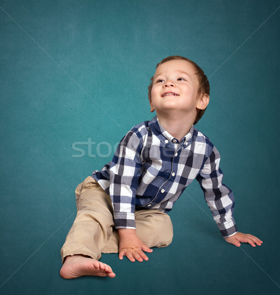 Cute boy siting on the floor Stock photo © leedsn