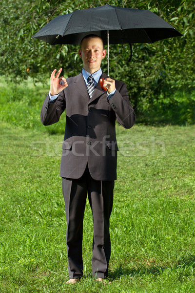 Affaires travail extérieur homme d'affaires cacher soleil [[stock_photo]] © leedsn