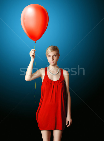 blonde in red dress with the red balloon Stock photo © leedsn