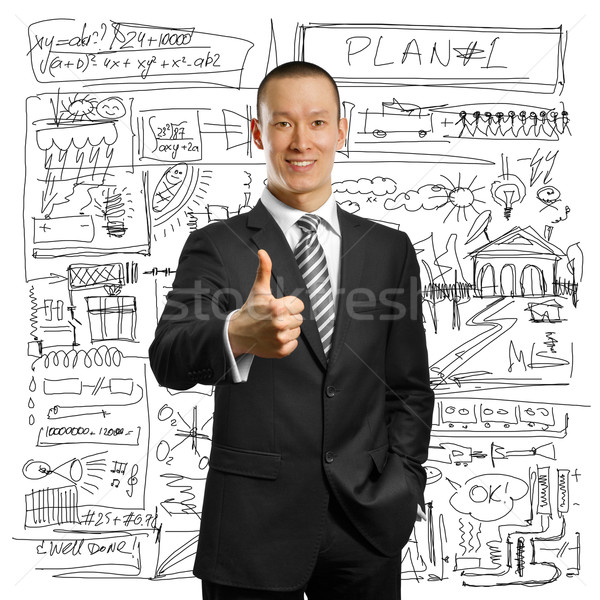 asian businessman in black suit shows well done Stock photo © leedsn