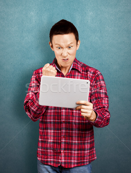 Asian Man With Touch Pad Stock photo © leedsn
