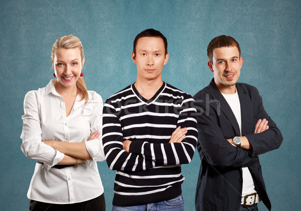 Teamwork and Asian Man In Striped Pullover Stock photo © leedsn