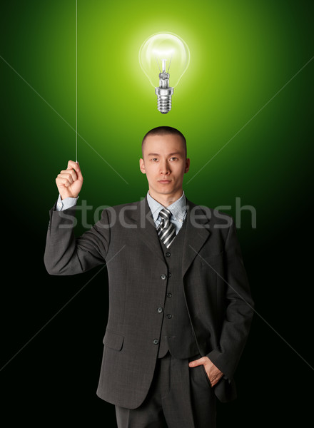 business man turn on the light Stock photo © leedsn