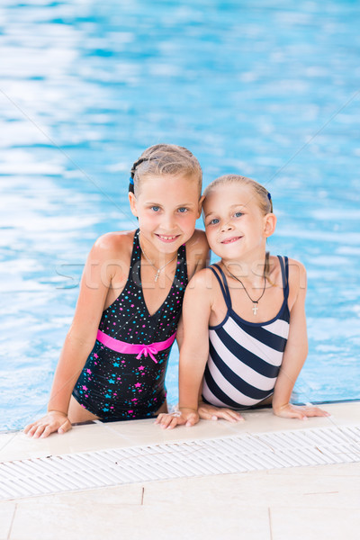 Two cute little girls in swimming pool Stock photo © Len44ik