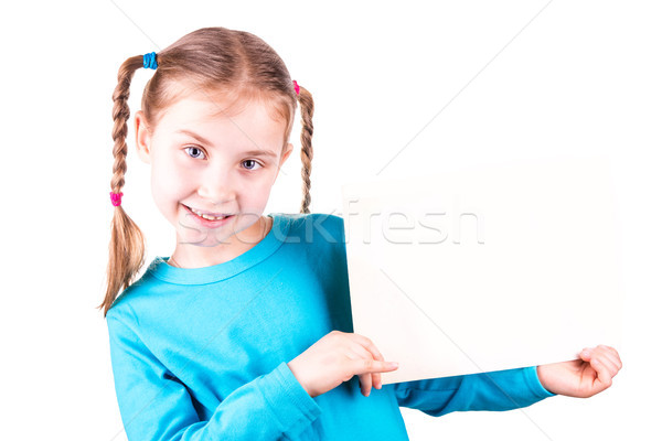 Smiling little girl holding white card for you sample text Stock photo © Len44ik