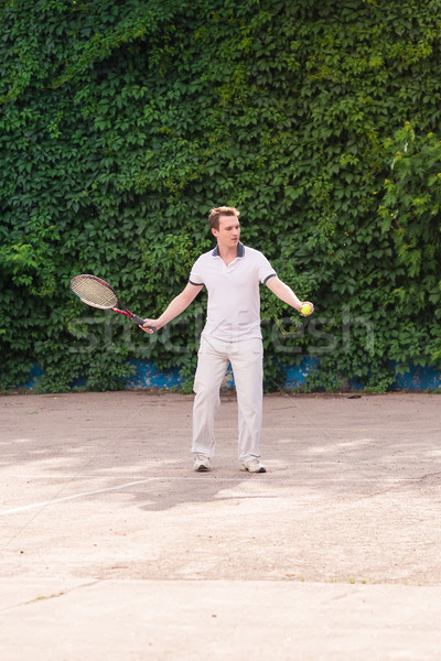 Expresivo joven jugando tenis aire libre naturaleza Foto stock © Len44ik